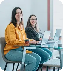 Two women on laptops